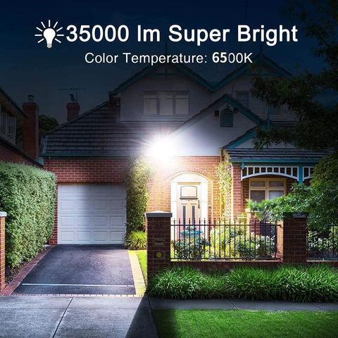 Ultra Bright 300W Solar Flood Light With 35000 Lumens Dusk To Dawn 6500K illuminating a house and driveway at night
