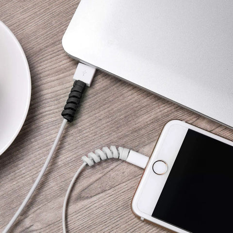 Gray and black 12 Piece Silicone Spiral Charging Cable Protectors for Micro USB and USB cords on laptop and phone cables.