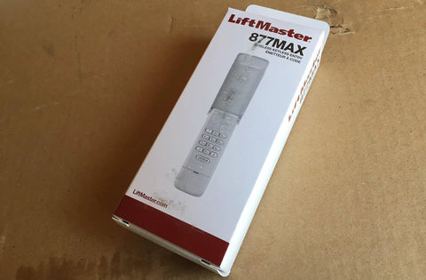 Box of Wireless Garage Door Opener With Backlit Keypad, Weatherproof Cover, And Security Two Point Zero Rolling Code Technology.