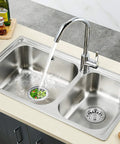Kitchen sink with No Fuss 2 In 1 Kitchen Sink Strainer Stopper, chrome plated stainless steel, water flowing, vegetables captured