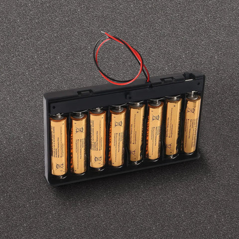 Kickass Hella Heavy Duty Eight Cell AA Battery Holder Box with reinforced lead wires and toggle switch on a dark surface.