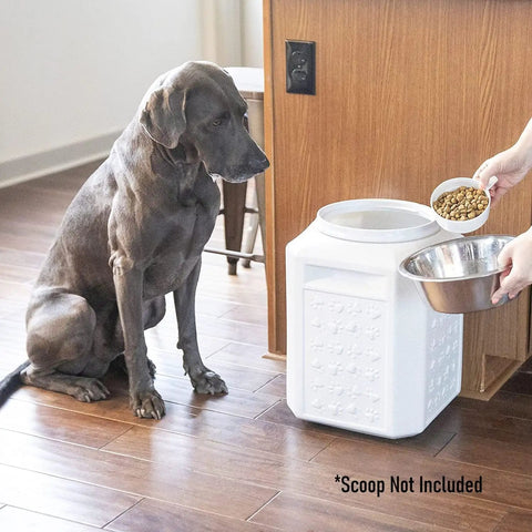 Air Tight Pet Food Storage Canister With Gamma Seal Lid beside dog during feeding, Keeps Fresh Tasting Dry Food, Holds Up To 35 Lbs