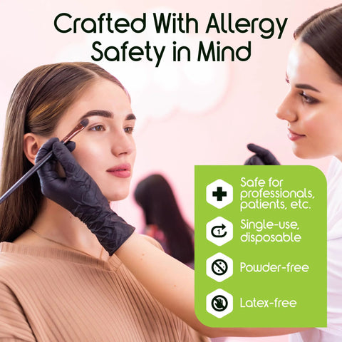 Front view: Inspire black nitrile gloves, large size, latex-free, worn by makeup artist applying makeup