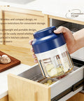 USB Rechargeable Mini Food Processor 320ML With 6 Stainless Blades Electric Garlic Chopper being stored in a kitchen drawer.