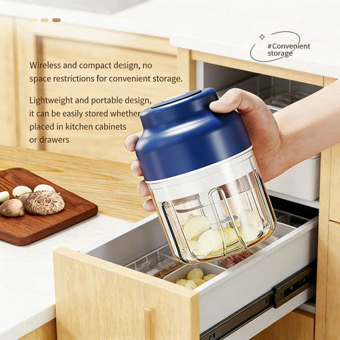 USB Rechargeable Mini Food Processor 320ML With 6 Stainless Blades Electric Garlic Chopper being stored in a kitchen drawer.