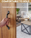 Two Pack Gate Handles For Wooden Gates With Screws Rustic Black Steel Door Pulls being gripped on wooden surface indoors