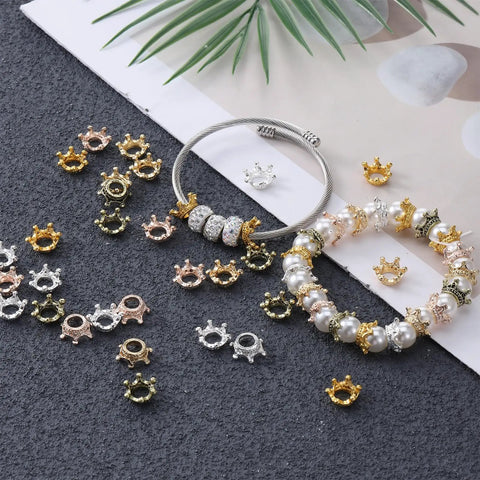 50 Pack Mini Crown Charms For DIY Jewelry Making, dope mixed color vintage 3D alloy king crowns with large hole displayed with bracelets