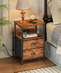 Sleek Rustic Brown Nightstand With Built In Charging Station And Two Fabric Drawers A Legit Game Changer For Dorm Rooms featuring a lamp and phone