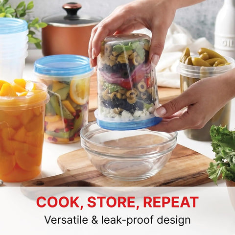 Person holding a Leakproof 10 Pack 32 Ounce Freezer Storage Containers With Twist Top Lids BPA Free Reusable Food Storage with layered salad