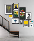 Gallery wall with various framed art prints including zoo, family, and animal designs beside a modern staircase.