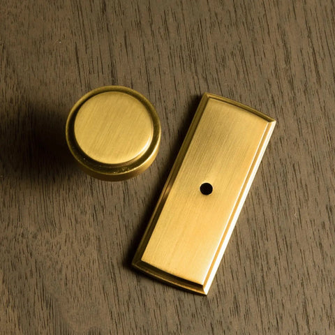 Brushed Gold Cabinet Knobs With Backplates, Zinc Alloy Kitchen Hardware on wooden surface