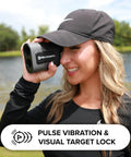 Person using Titan Golf Rangefinder With Slope Switch And Adaptive Slope Technology near a lake on a golf course.