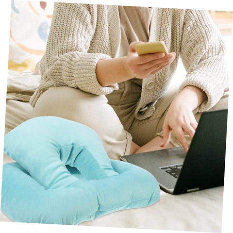 Person using laptop with Office Desk Nap Pillow Ergonomic Face Down Rest Cushion Plush Lightweight Portable Sleep Pillow nearby