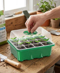 Person adjusting humidity dome on a 5 Pack Seed Starter Trays With Adjustable Humidity Dome And Base Indoor Greenhouse Mini Propagator, 12 Cells Per Tray, Clear, Reusable Seedling Starter Kit For Easy Germination And Plant Growth.