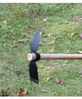Multipurpose Garden Pick And Mattock Hand Tool For Digging Weeding Turning Soil Planting Intertillage shown on grass