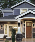 Dusk To Dawn Sensor Outdoor Wall Lights 4 Pack Up And Down Aluminum Waterproof Wall Sconces on house exterior during dusk.