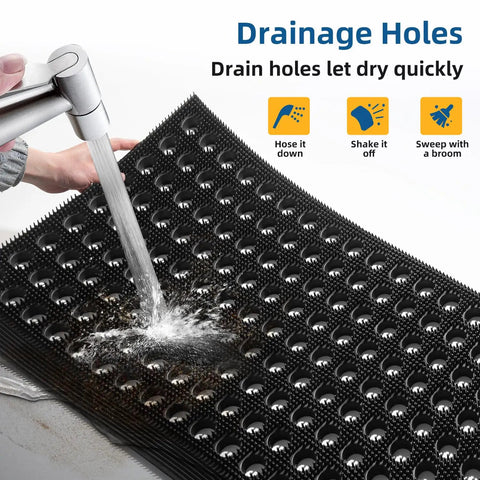 Water running over Heavy Duty Outdoor Doormat with All Weather Waterproof Construction Non Slip Drainage Entry Mat For Garage Home Pool Or Commercial Use Dirt Trapper Welcome Rug 17 By 29.5 Inches Black showing drainage holes.
