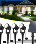 4 In 1 Solar Landscape Spot Lights Outdoor Waterproof Garden Lights With Auto On Off For Lawn Patio Yard And Pool Area White 6000K LED Pathway Lighting For All Night Brightness showing multiple lights in garden