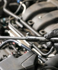 Mechanic using Extendable Pry Bar With 13.3 To 18.5 Inch Reach 14 Position Adjustable Angled Head in engine bay