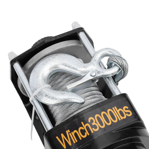 Close-up of the Rock Solid 3000 Pound Electric Winch with steel rope and hook, designed for heavy loads.