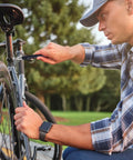 Man using Nine In One Multitool Pen Set Great Stocking Stuffers For Men Dad Boyfriend Husband From Daughter Cool Gadgets For Guys Who Have Everything Perfect Gift For Christmas And Everyday Use With Durable Aluminum Build And Sleek Design to fix bicycle outdoor