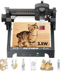 Front view of ACMER S1 desktop laser engraver, black frame with 130×130mm work area; wood panel with cat engraving.