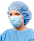 Woman wearing Four Layer Level 3 Medical Procedure Mask With Anti Fog Foam Ear Loops Blue Latex Free Ultra Breathable Comfort