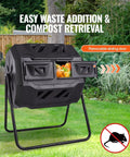 Beefy Dual Chamber 43 Gallon Compost Tumbler With Rotating Design And Two Doors in a garden setting with sliding door open.