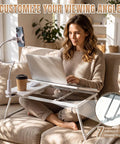White Adjustable Laptop Desk For Bed With Storage Drawer And Phone Stand 23.6 Inch large surface being used for cozy study setup.