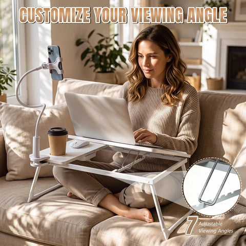 White Adjustable Laptop Desk For Bed With Storage Drawer And Phone Stand 23.6 Inch large surface being used for cozy study setup.