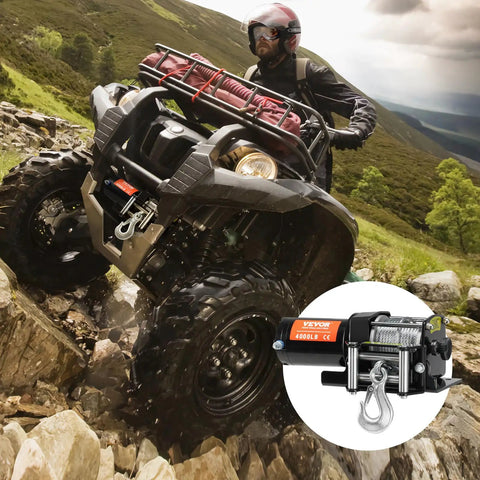 VEVOR 4000 Lb Electric Winch For Atv And Utv Recovery mounted on an ATV tackling rocky terrain with a rugged backdrop.