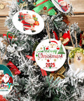 Two-Sided Sublimation Ceramic Ornament Blanks on Christmas tree with 2025 design and gold string, vibrant double-sided prints visible