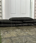 Flood protection with Grab And Go Flood Kit with 20 Water Activated Flood Bags, blocking flood water at a door entrance.