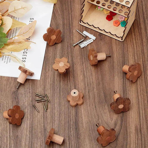 10 Pcs Flower Wooden Cabinet Knobs In Coconut Brown, Two Sizes on a wooden surface with screws, floral drawer pulls.