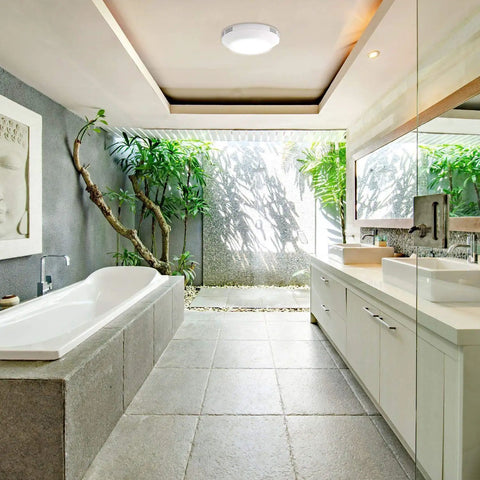 Bathroom with integrated LED light ceiling mount exhaust fan, white finish for removing humidity and odors, enhancing comfort.