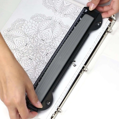 Person using On The Go 3 Hole Binder Punch For Ring Binders, Ultra Compact And Portable, Punches Up To Five Sheets At A Time With Easy Grip.