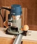 Top Shelf Router Dado Jig With CNC Machined Aluminum Carriage And One Inch Precision Bushing for woodworking setup on a workbench.