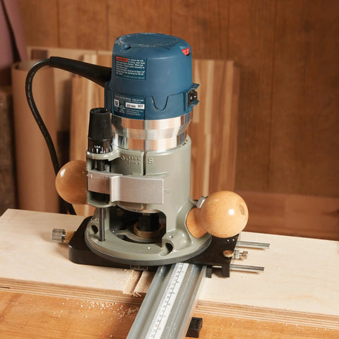 Top Shelf Router Dado Jig With CNC Machined Aluminum Carriage And One Inch Precision Bushing for woodworking setup on a workbench.