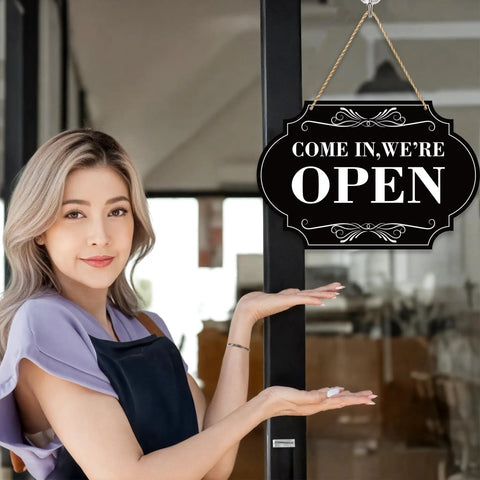 Woman pointing to Waterproof Double Sided Open Or Closed Sign For Business With Rope Hanging Sign 11.8 By 7.9 Inches on door