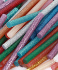 Colored Glitter Hot Melt Glue Sticks Set in 14 Colors, mini sticks close-up showing variety of glittery colors and textures.