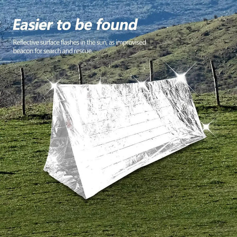 Emergency Survival Reflective Blanket For Camping And Hiking Packable Thermal Shield Multipurpose Tent on grassy field