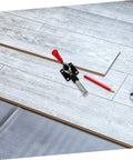 Fast Locking Level Fastener Push Pull Clamp For Vertical Fixtures on laminate flooring with red plastic handle.