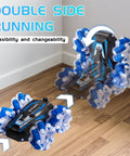 Two YEMIAI RC stunt cars, blue and black with clear blue wheels, 4WD, double-sided, front-left view.