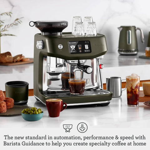 Oracle Jet Semi Automatic Espresso Machine Featuring Precise Heat Control Silky Milk Frothing Swipe Interface And Cold Brew Mode For Next Level Coffee Vibes At Home with stainless steel portafilter and coffee cups on counter.