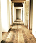 Wood floor stained with Top Shelf Golden Oak Reactive Wood Stain, featuring classic amber glow in a hallway setting.