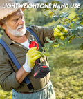 Senior man using Electric Pruning Shears With LCD Display For Precise Garden Trimming on tree branch