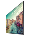 Massive 82 Inch 4K Uhd Led Commercial Signage Display showing vibrant view of a canal-lined city in profile orientation.