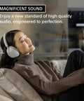 Person relaxing with WH-1000XM5 Premium Noise Canceling Headphones With Auto NC Optimizer All Day Battery Life black on sofa.