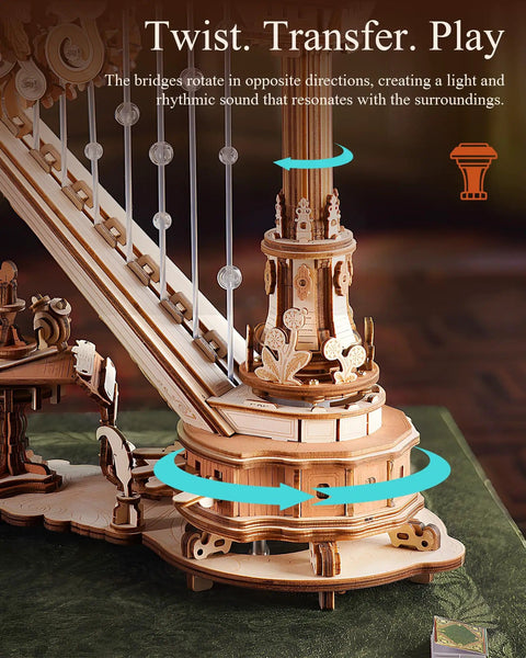3D Wooden Harp Music Box Kit For Adults, close-up of rotating bridges and mechanical details on a green table.