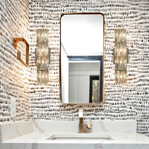 Bathroom with twin Chrome Crystal Wall Sconce With Four Lights Modern Tube Shape Glass Wall Light Fixture beside a mirror.